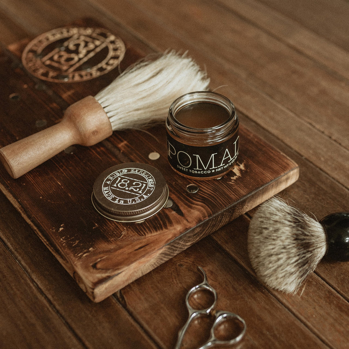 18.21 Man Made Pomade in use for a sleek hairstyle