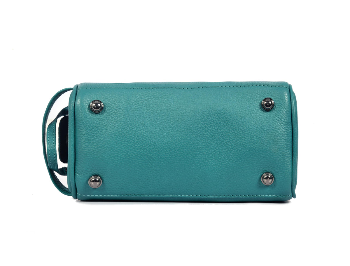 AARON LEATHER GOODS toiletry bag dimensions displayed alongside grooming essentials