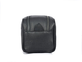 AARON LEATHER GOODS toiletry pouch lifestyle scene in a travel setting