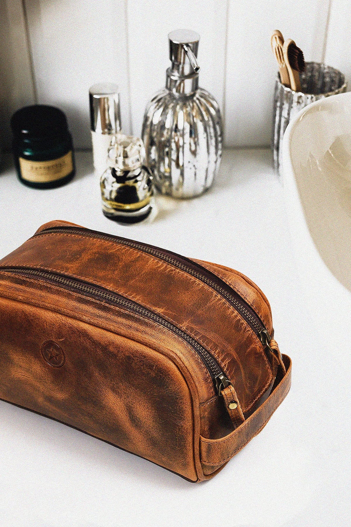 AARON LEATHER GOODS toiletry pouch on a travel bag