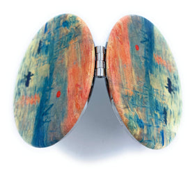 Aeisage Compact Makeup Mirror displayed with artistic background