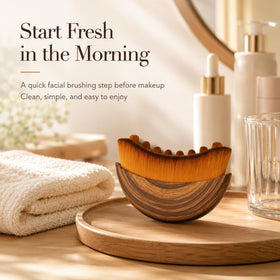 AEKI Lymphatic Contour Face Brush rinsed and drying on a towel