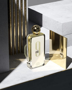 Afnan 9 AM Unisex Eau De Parfum bottle on a table