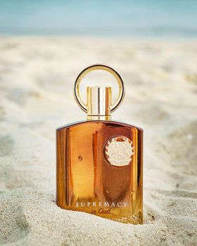 Afnan Supremacy in Oud Extrait de Parfum bottle on a table