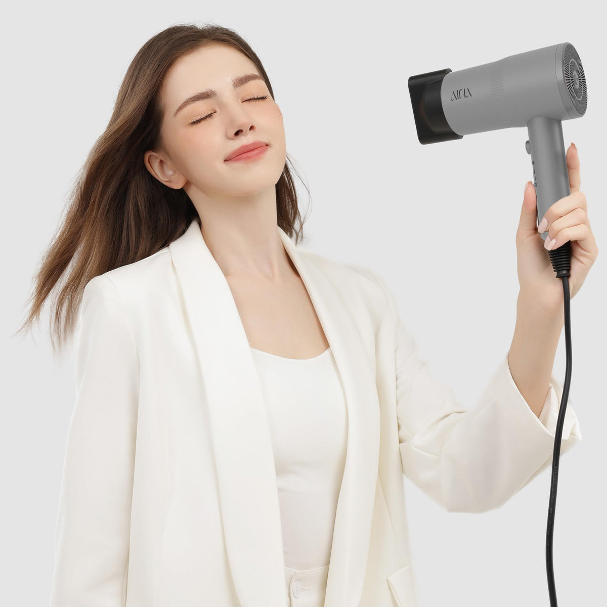 Aina Diffuser Hair Dryer in use styling hair