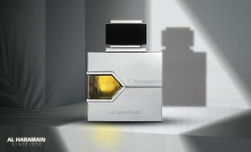 Al Haramain L'aventure Eau De Parfum Spray with a watch and sunglasses