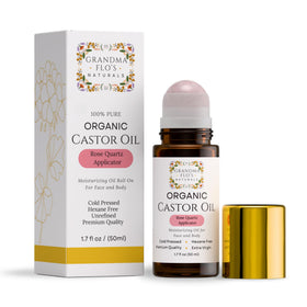 Amber glass bottle of Grandma Flo's Naturals Organic Castor Oil with rose quartz roller