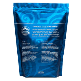 Ancient Minerals Magnesium Bath Flakes lifestyle scene with candles
