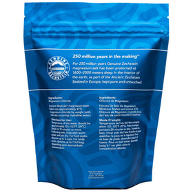 Ancient Minerals Magnesium Bath Flakes on a bathroom shelf