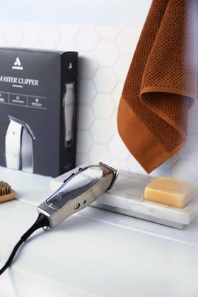 Andis Master Hair Clipper on a grooming table