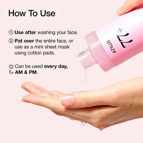 ANUA Peach 77 Niacin Essence Toner with a dropper showing texture