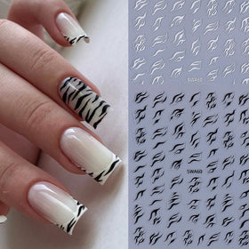 Application of leopard print nail art stickers on nails