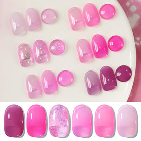 Application of milky translucent pink gel nail polish