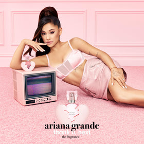 Ariana Grande Thank U Next Eau de Parfum bottle with floral background