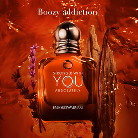 Armani Beauty Stronger With You Absolutely Parfum on a wooden surface
