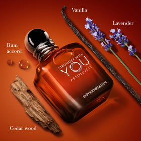 Armani Beauty Stronger With You Absolutely Parfum with a backdrop of spices