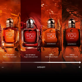 Armani Beauty Stronger With You Intensely cologne on a wooden surface