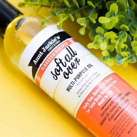 Aunt Jackie's Multi-Use Oil 8 Fl Oz with a dropper dispensing oil