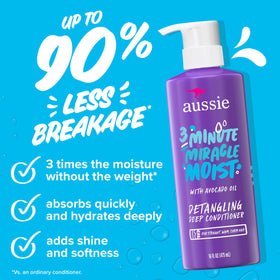 Aussie Miracle Moist Shampoo and Conditioner set on a bathroom shelf