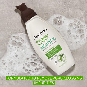 Aveeno Clear Complexion Foaming Cleanser in a bathroom setting
