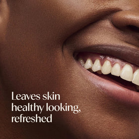 Aveeno Makeup Removing Wipes with a hand reaching for a wipe