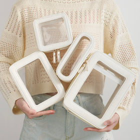 Aveniee Clear Makeup Bag Organizer Set on a travel suitcase