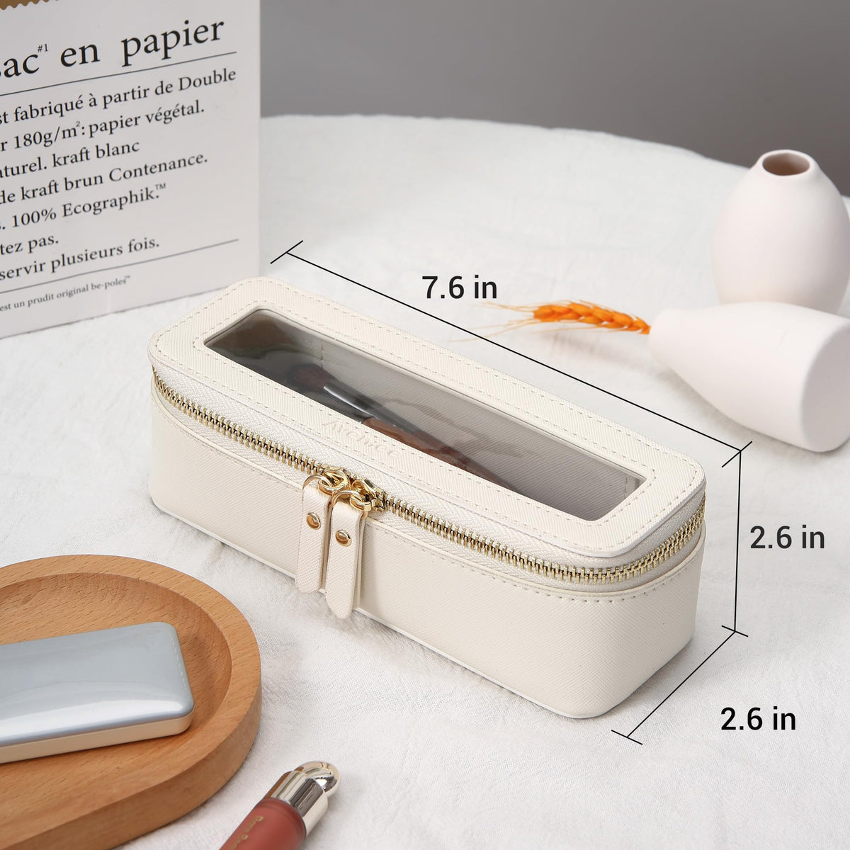 Aveniee Clear Makeup Brush Bag in a travel setting with cosmetics