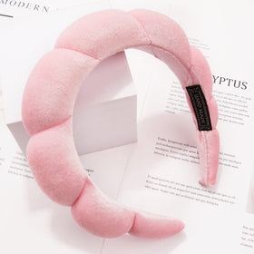 Ayesha Fluffy Bubble Headband worn by a model during skincare routine