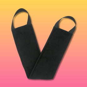 B.TAN mitts being used for self-tanning application