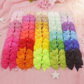 Babymatch Baby Hair Bows Clips displayed on a table