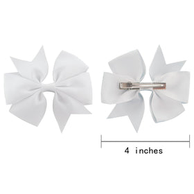 Babymatch Pinwheel Hair Bows displayed on a table