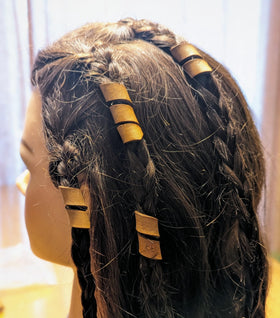 Back view of leather hair bead showcasing craftsmanship