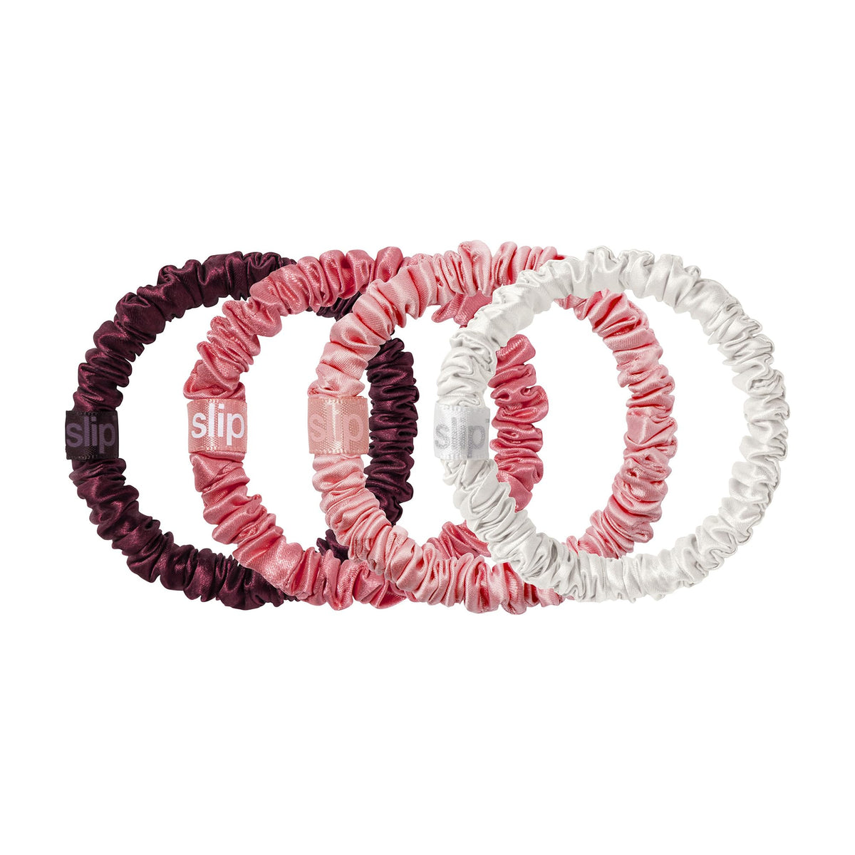 Back view of SLIP silk scrunchies in festive packaging