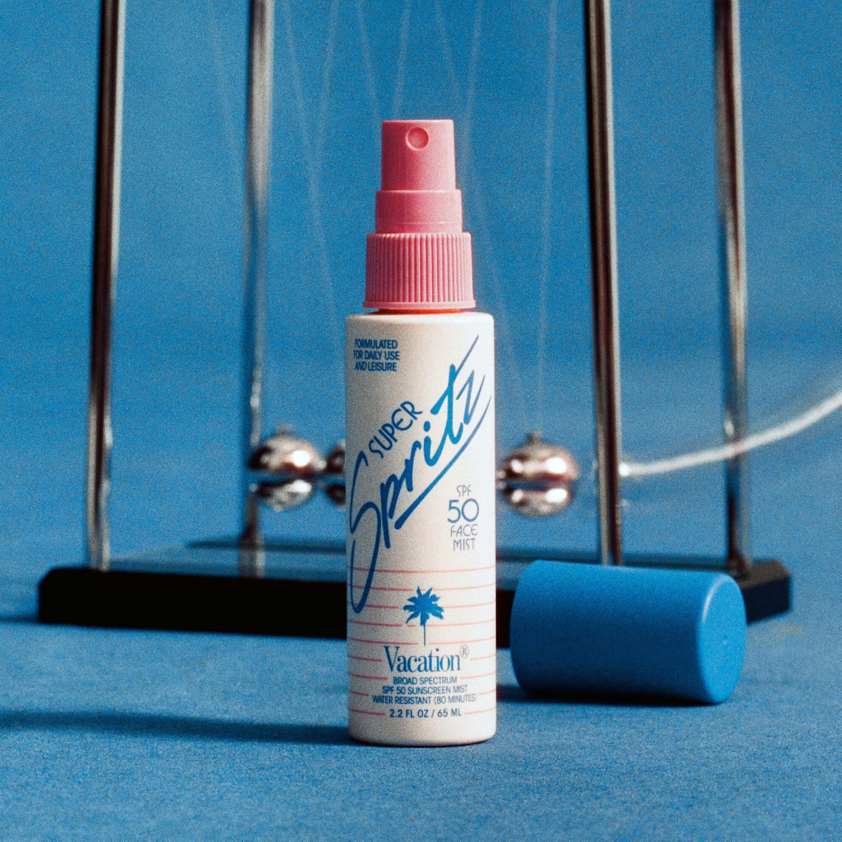 Back view of VACATION Mini Super Spritz SPF 50 face spray