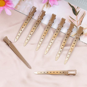 Bantoye Duck Bill Clips GS Brown on a styling table