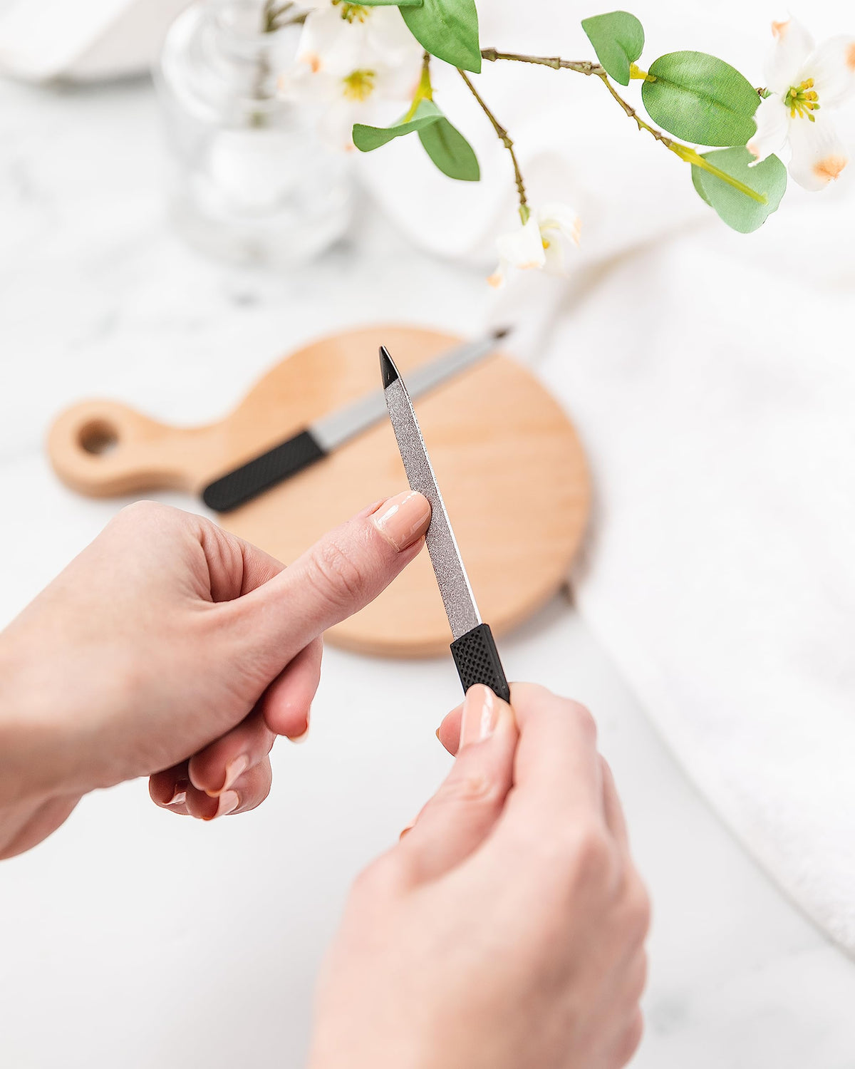 Basics Double Sided Sapphire Nail File in use on nails