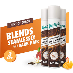 Batiste Dark Dry Shampoo bottle on vanity with flowers