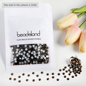 BEADSLAND rhinestones in use on a decorative bag