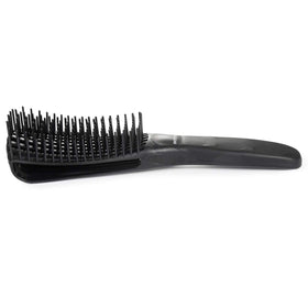 BESTOOL Detangling Brush in use on curly hair