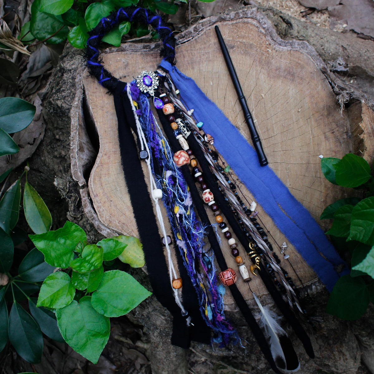 Black dreadlock hair tie in a lifestyle setting