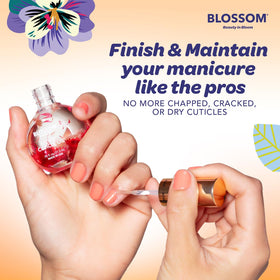 Blossom Cuticle Oil applied to nails for hydration