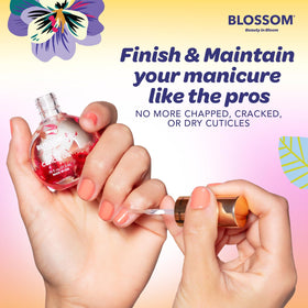 Blossom Cuticle Oil in hand with dried flowers