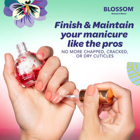 Blossom Cuticle Oil Watermelon with a hand applying oil