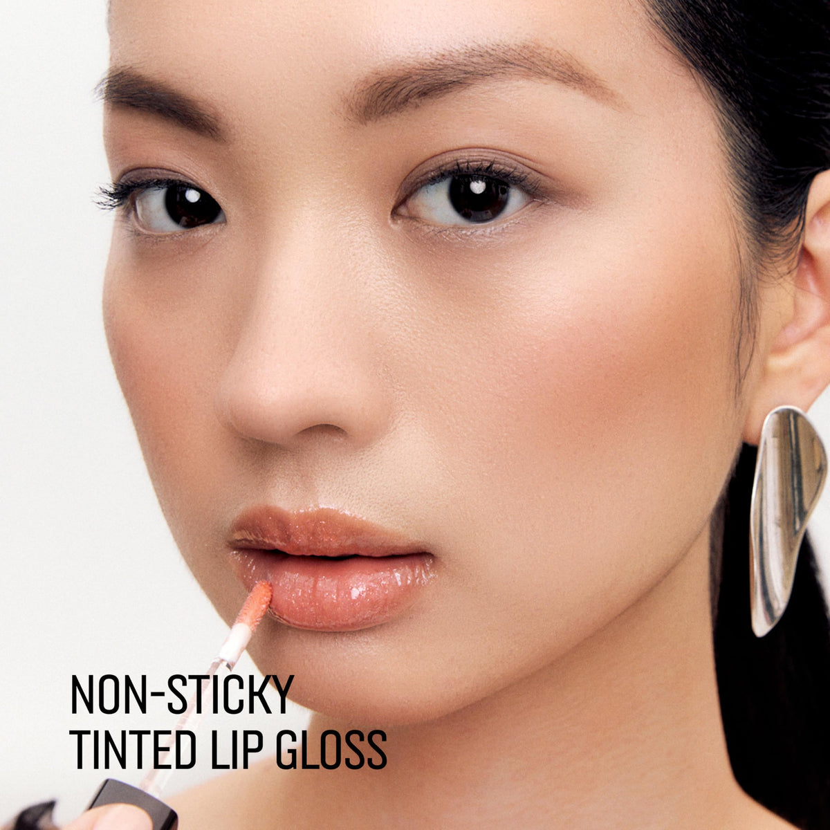 Bobbi Brown Crushed Oil-Infused Gloss In the Buff swatch on lips