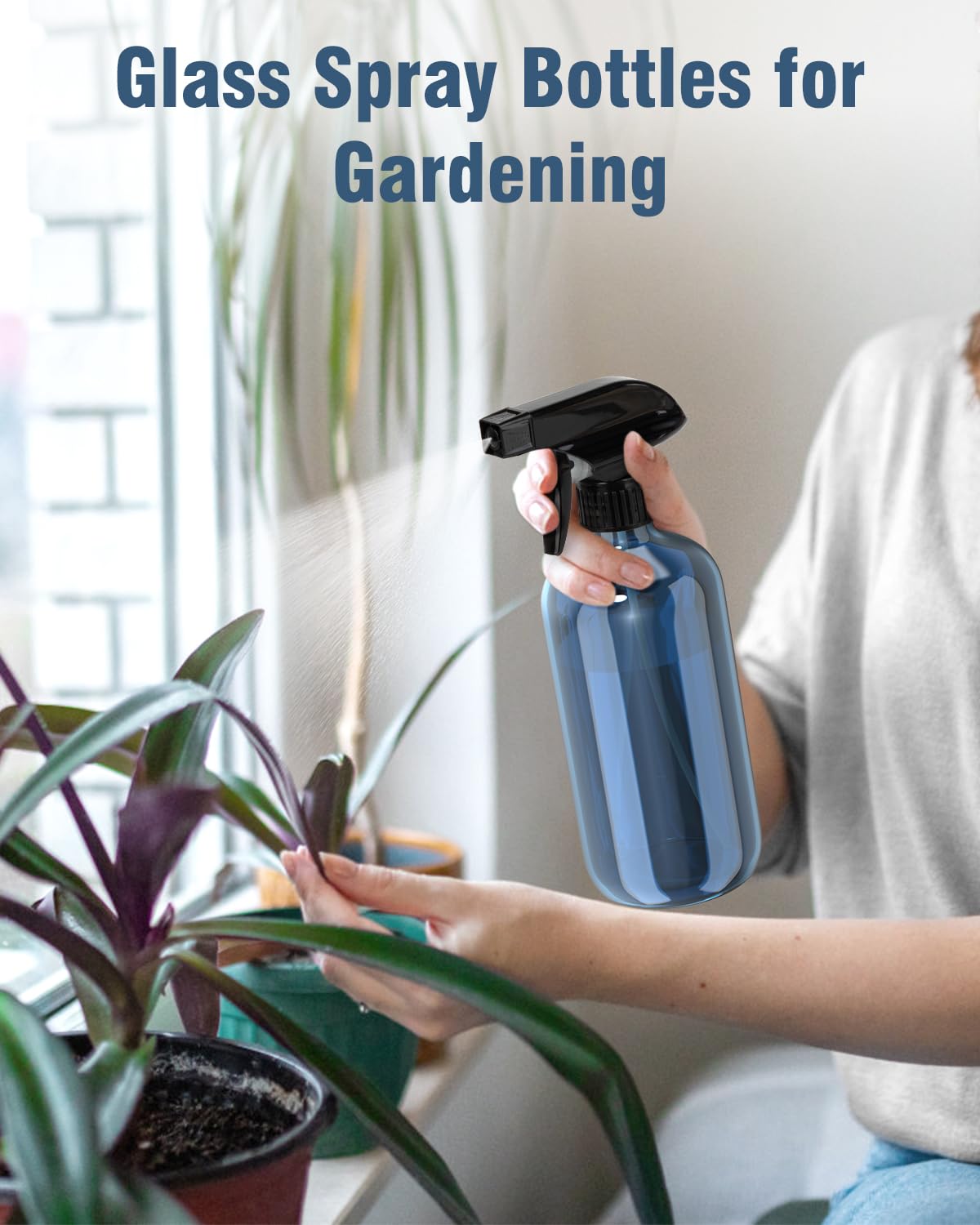 Bontip Glass Spray Bottle 16 oz Indigo Blue in use for plants