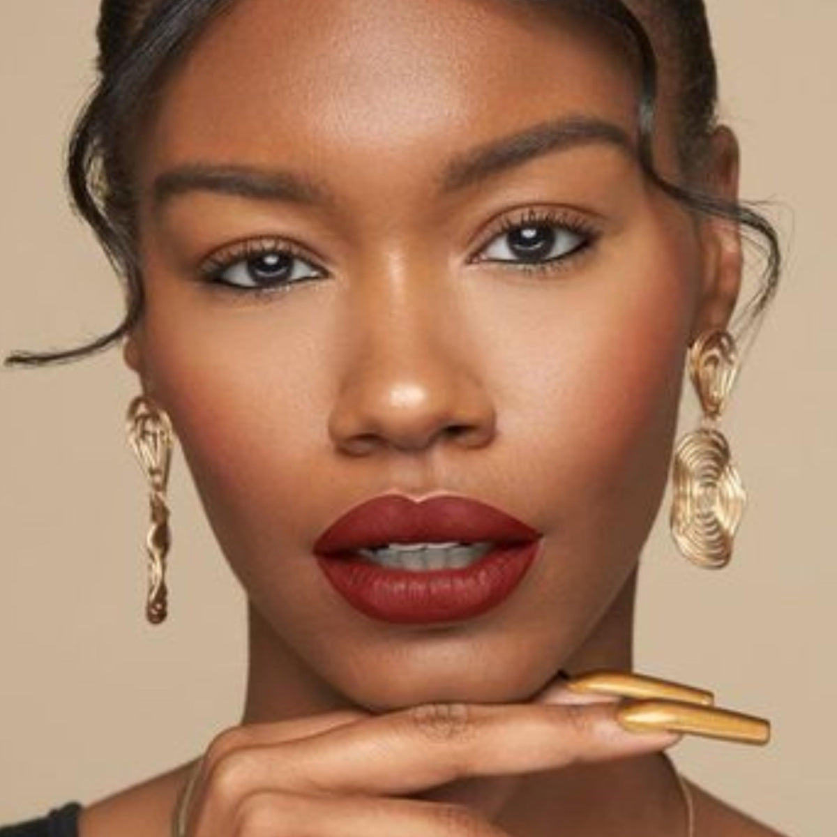 Brickhouse liquid matte lipstick tube with soft brown colour