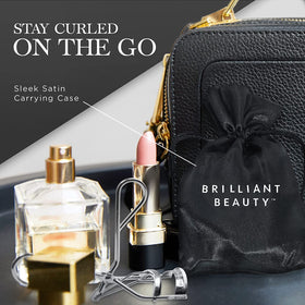 Brilliant Beauty Eyelash Curler on a vanity with makeup tools