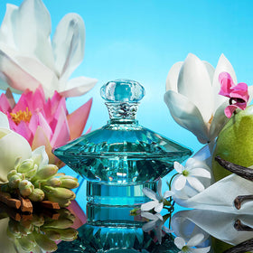 Britney Spears Curious Eau De Parfum 30ml with floral background
