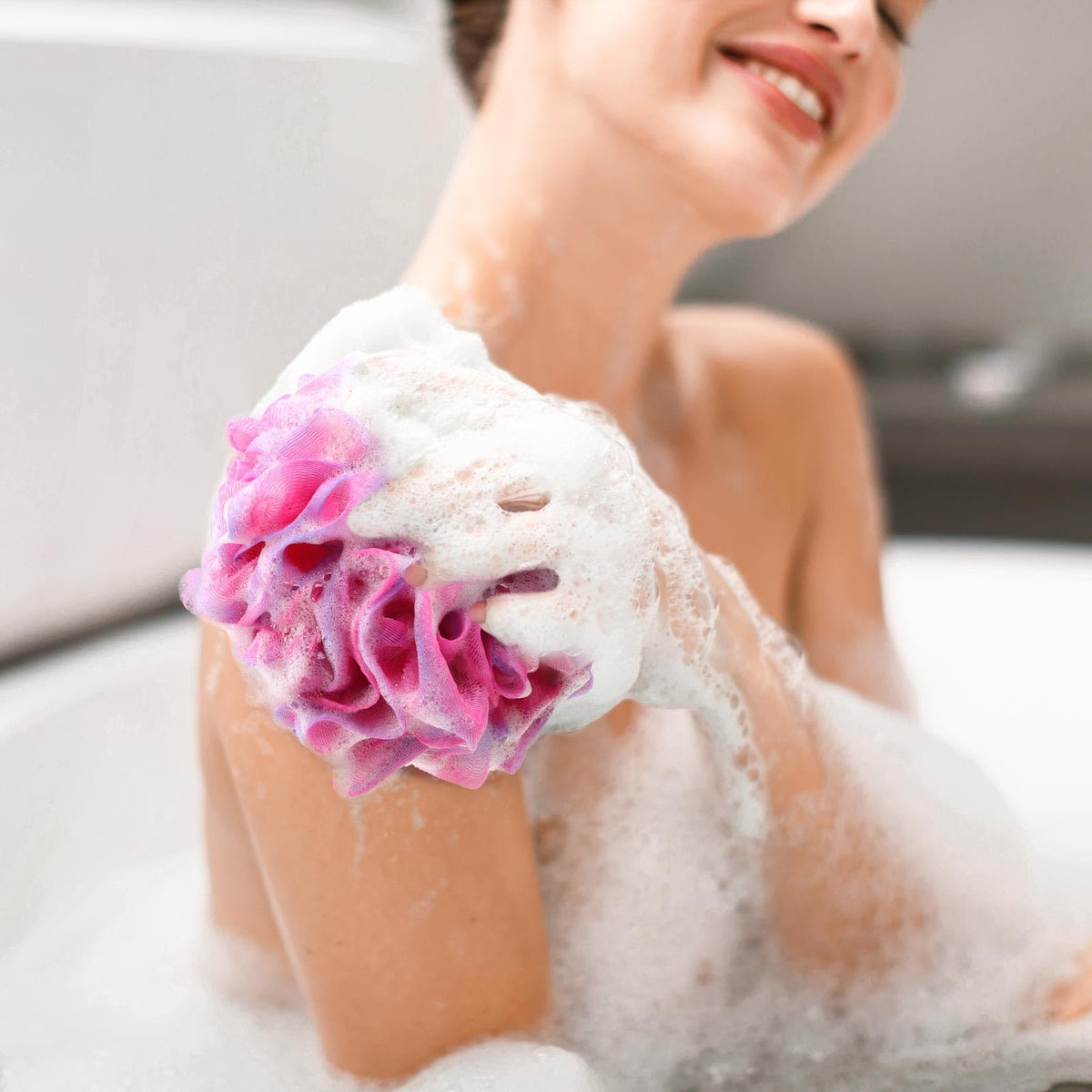 BTYMS loofah sponges displayed in a bathroom setting