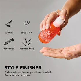 Bumble and bumble. Hairdresser's Invisible Oil with a model applying it